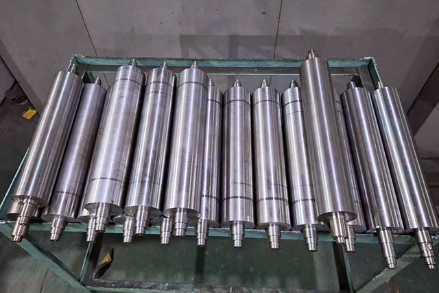 batch of ceramic anilox rollers staged for final quality check before shipment